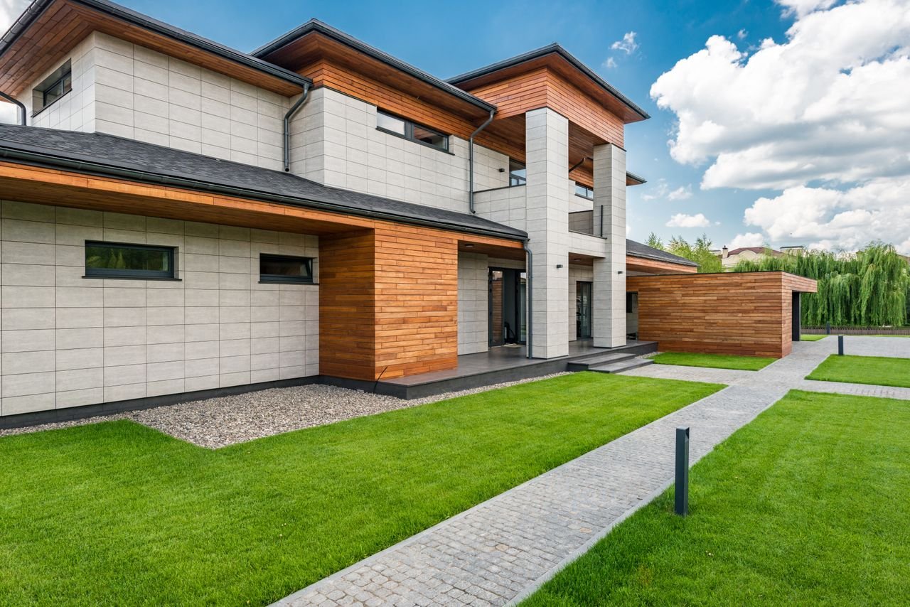 The Art of Drawing Readers In: Your attractive post title goes here Exterior of contemporary residential house with green lawn and paths in sunny day